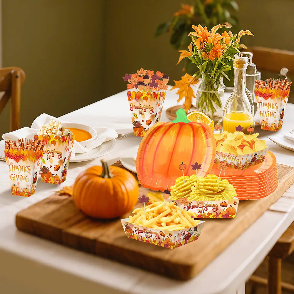 Thanksgiving pumpkin paper plates feature an orange paper pumpkin design with a green stem and autumn leaf pattern for seasonal tableware use.