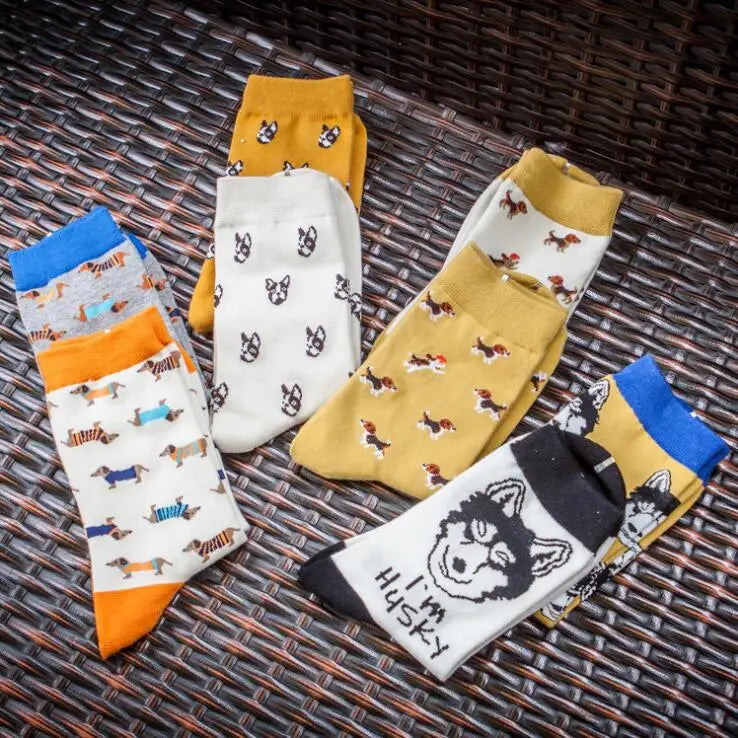 A collection of colorful cute dog cartoon cotton crew socks featuring playful designs of dachshunds, beagles, and huskies in yellow, white, gray, and orange.