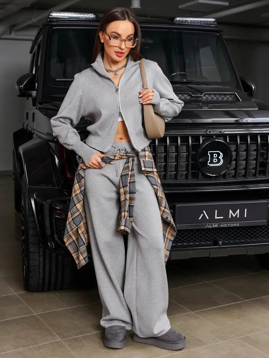 Gray knit zip-up hoodie with a cropped fit and ribbed cuffs from the women’s knit zip up cardigan and wide leg pant set.