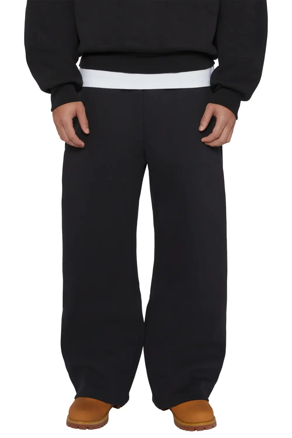 Black fleece wide-leg sweatpants with a contrasting white elastic waistband designed as unisex joggers.