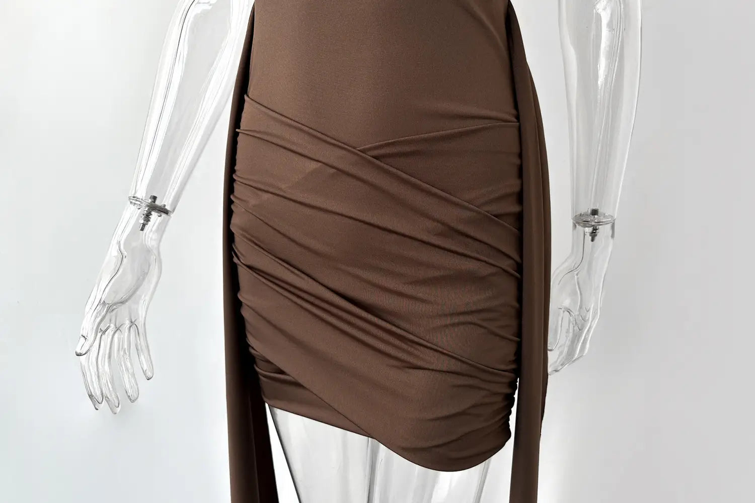A sleek chocolate-brown ruched midi dress with a high neck, slim fit, draped asymmetrical design, and side slit.