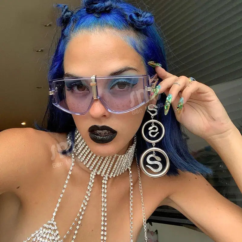 Futuristic oversized vintage shield UV400 sunglasses with transparent frames, gradient purple lenses, and metallic gold accents.