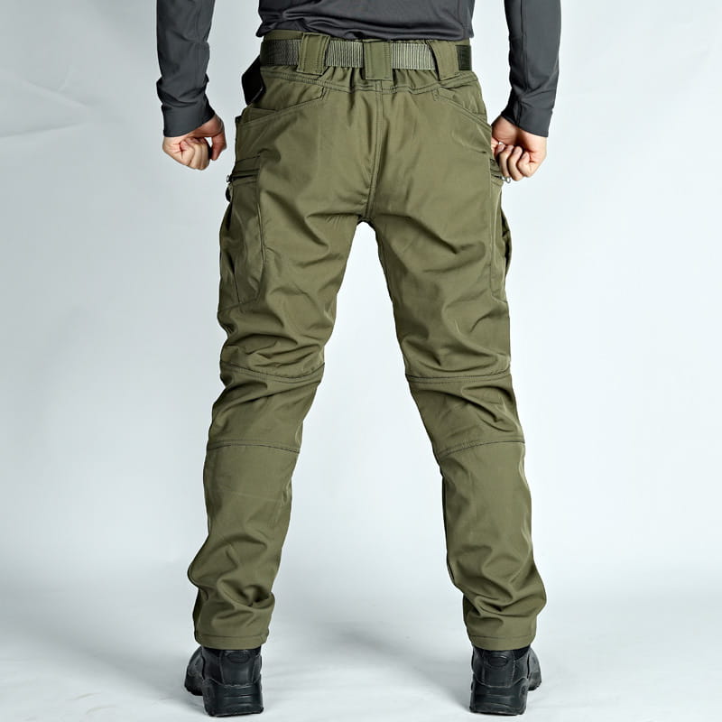 Men’s olive green fleece-lined waterproof tactical pants featuring multiple cargo pockets and a reinforced belt loop system.