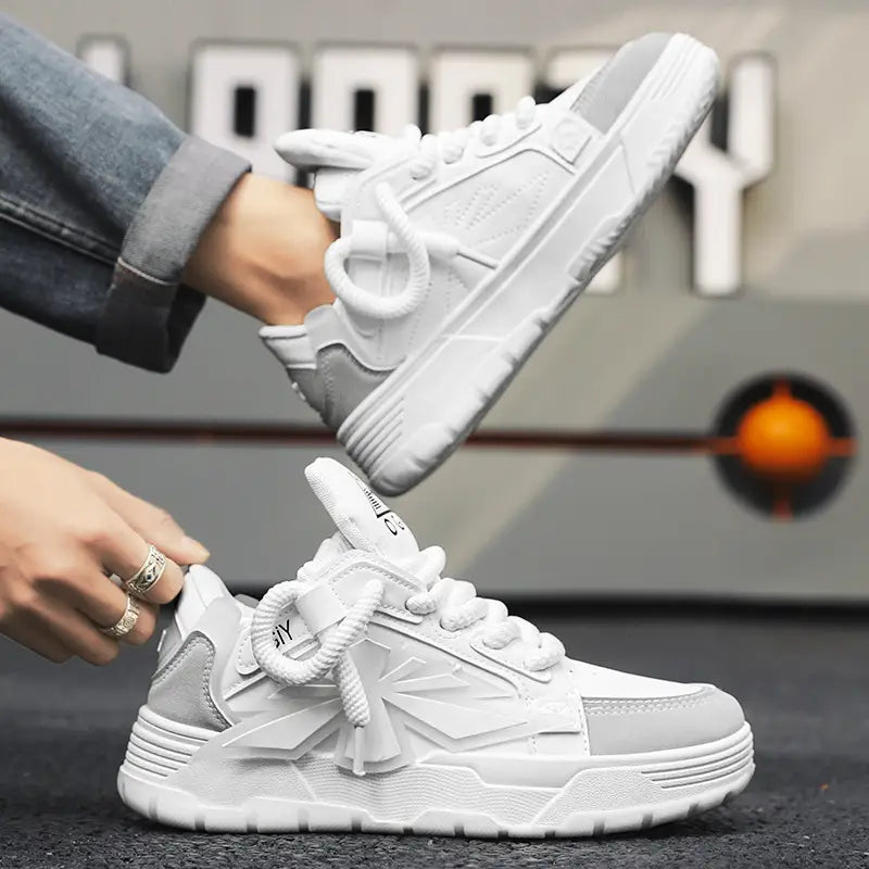 Chunky sneakers for men Harajuku low top shoes in white and light gray featuring a thick rubber sole braided laces and geometric paneling.