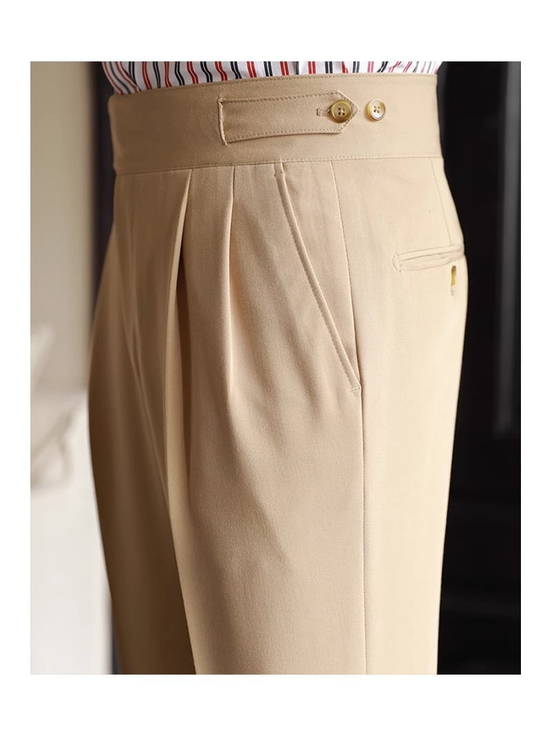 Beige tailored pleated wool straight leg trousers with a waistband and gold-tone buttons for men.