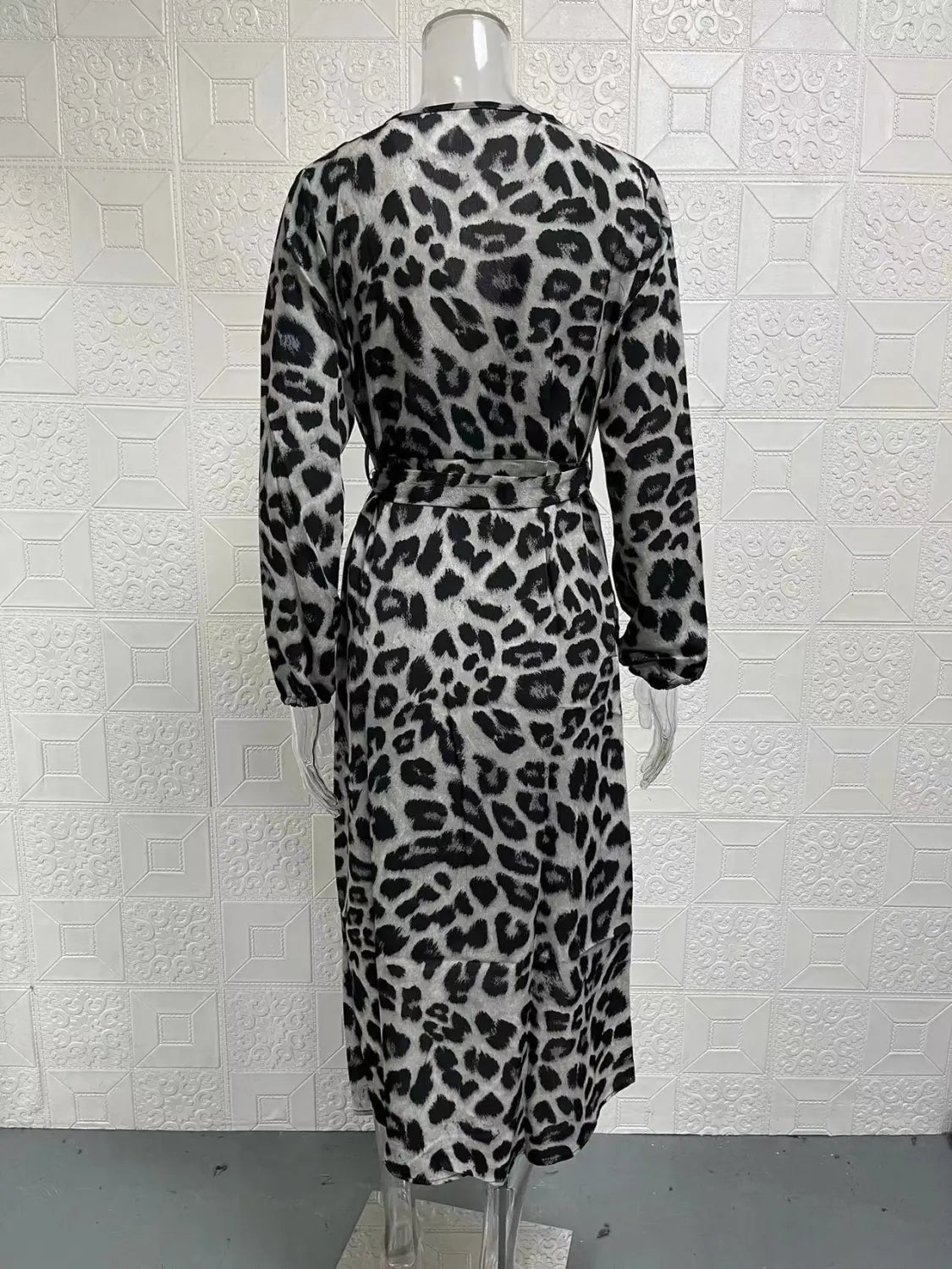 Black and white leopard print chiffon wrap dress with long sleeves v neck and belted waist.
