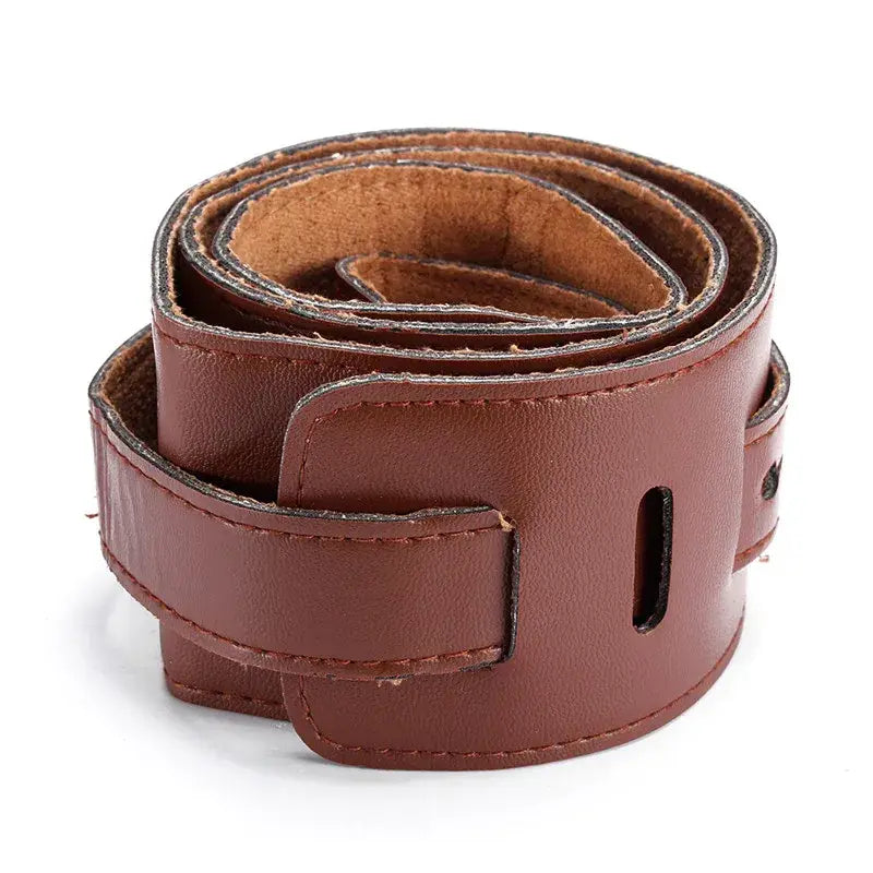 Brown leather guitar strap with adjustable simple buckle design and suede lining measuring 110-130cm.