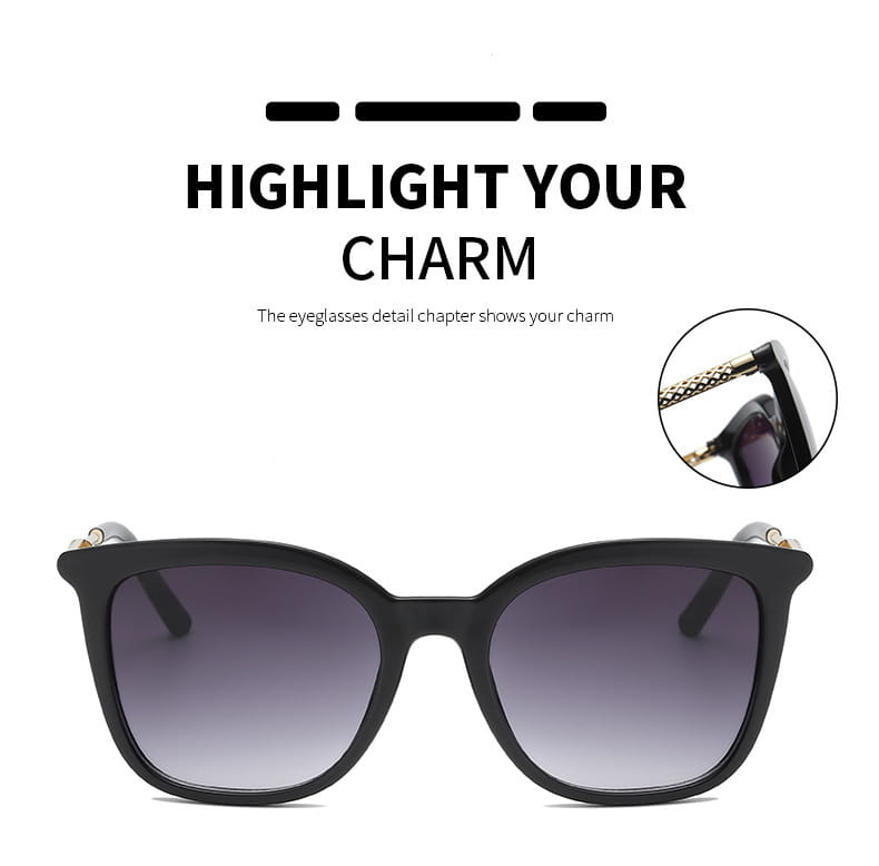 Vintage cat eye sunglasses featuring black frames, gradient gray lenses, and gold-tone decorative accents on the temples.