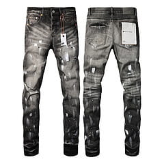 Men’s distressed slim fit patchwork denim jeans in black with ripped and faded details made from denim material.