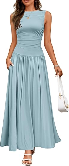 A flowing light blue sleeveless maxi dress with a ruched bodice pleated details and side pockets perfect for elegant occasions.