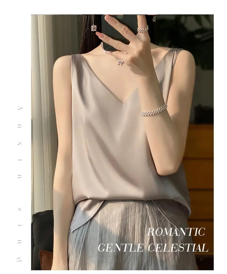 A soft sleeveless satin camisole top in muted lavender with a v-neckline and relaxed fit.