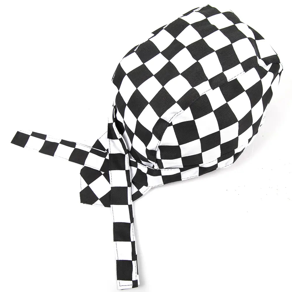 black and white checkered fabric chef hat with adjustable ties shown from the back side for kitchen work use