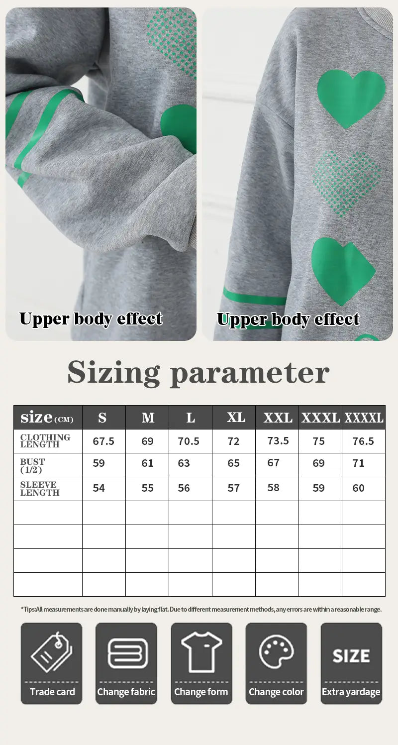 gray oversized sweatshirt featuring green heart patterns on the sleeves suitable for casual wear