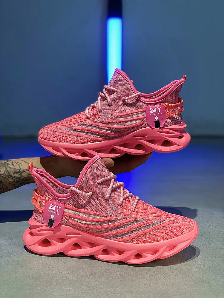 Pink flyknit mesh platform running shoes for men featuring a chunky translucent rubber sole and silver reflective stripes.