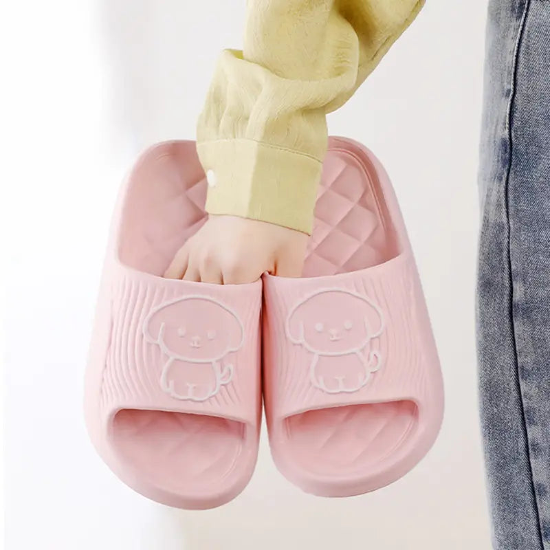 Pink plastic dog cartoon slide sandals with a cute puppy design on the EVA non slip footbed for house use.