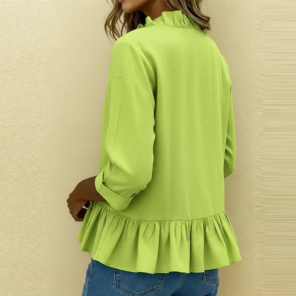 A vibrant lime green solid color ruffle hem peplum t shirt blouse featuring a ruffled neckline and peplum hem.