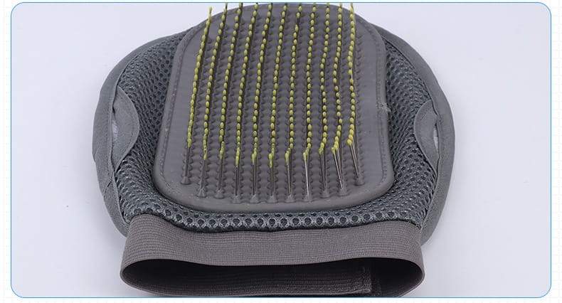 Pet grooming glove made of gray silicone with yellow-tipped bristles and a mesh design used as a hair remover bath brush.