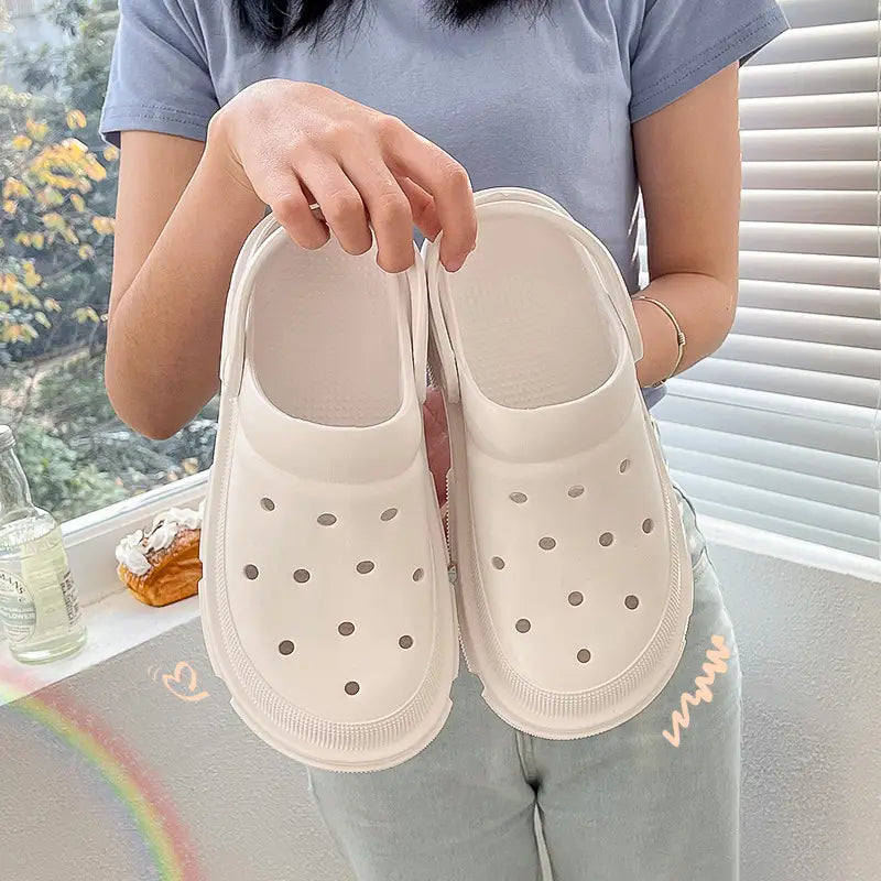 pink rubber unisex lightweight eva garden clogs and beach slippers with thick textured sole and circular perforations