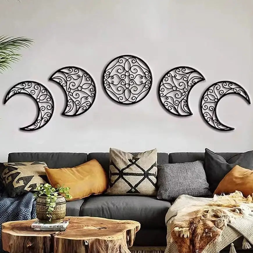 Black wrought iron wall art featuring a sequence of five ornate moon phases in black metal for decorative use.