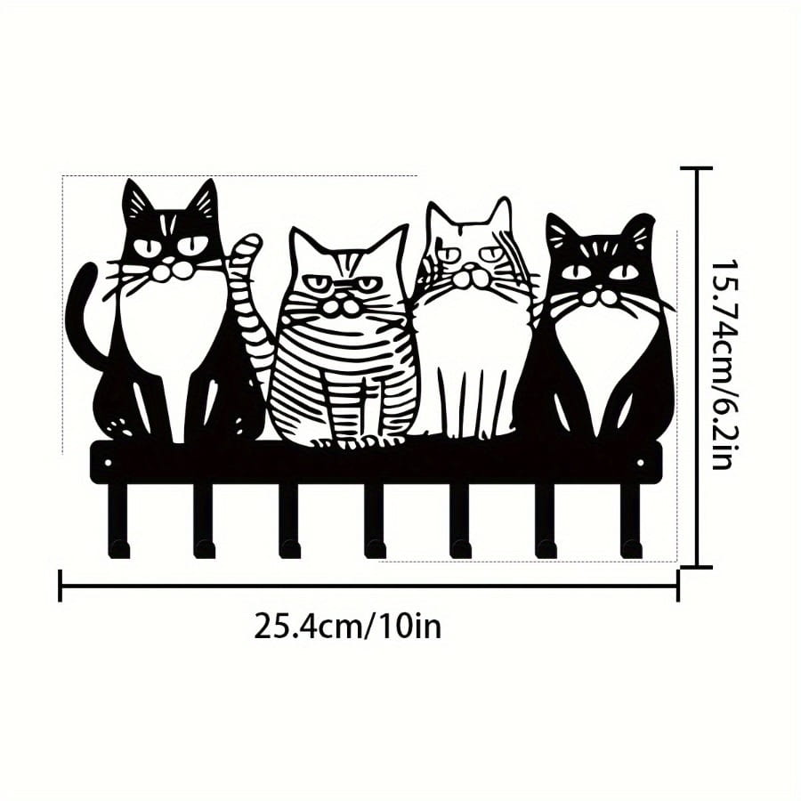 black metal wall-mounted key rack featuring four stylized cats with distinct markings and expressions for home decor with four hooks.