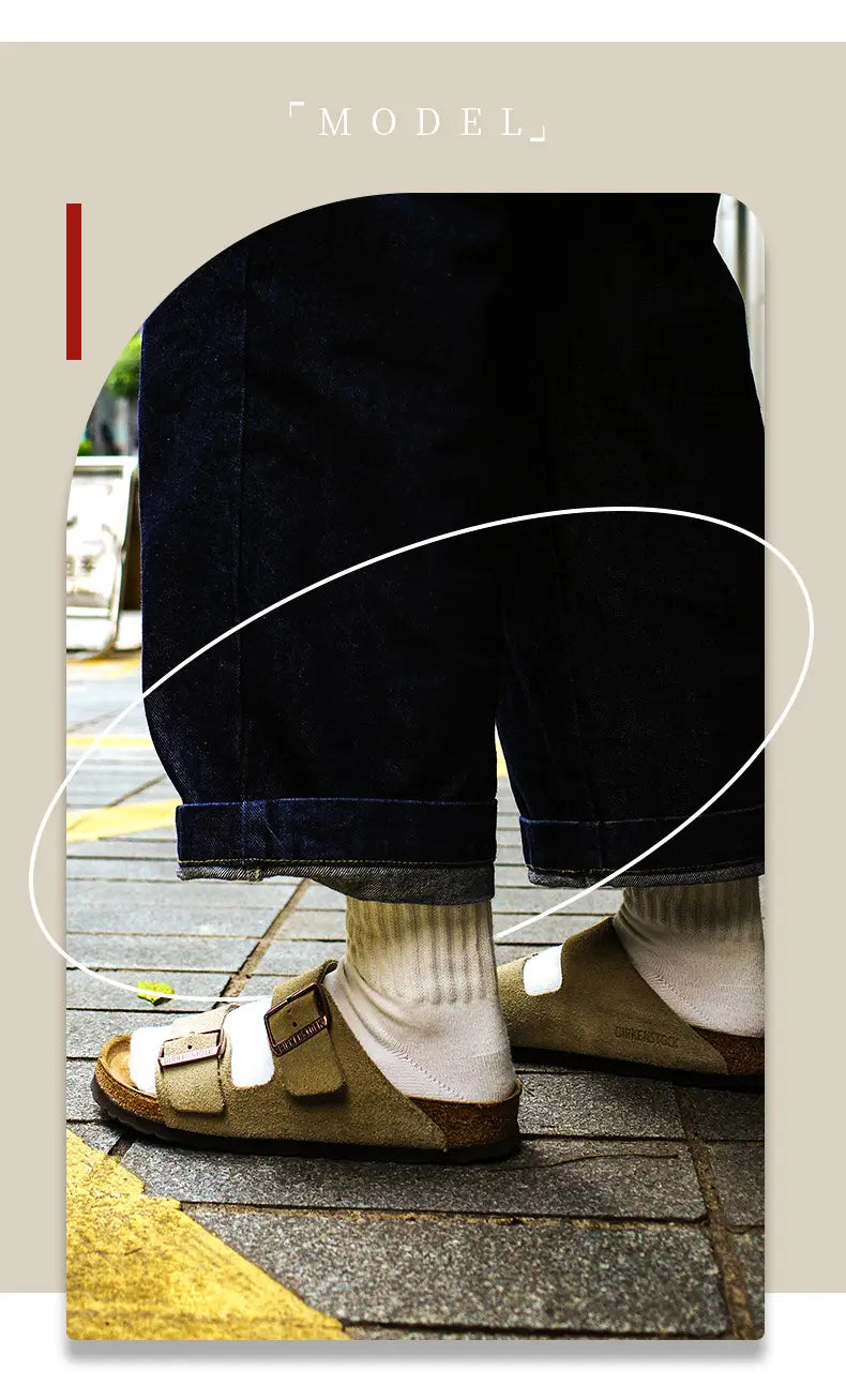 Tan leather Birkenstock sandals with two adjustable straps and a cork footbed paired with vintage ribbed cotton long socks for men.