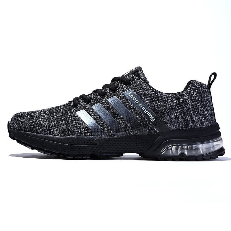 Men’s air cushion knit running sneaker in black and gray with silver stripes, black laces, and a transparent air cushion sole.
