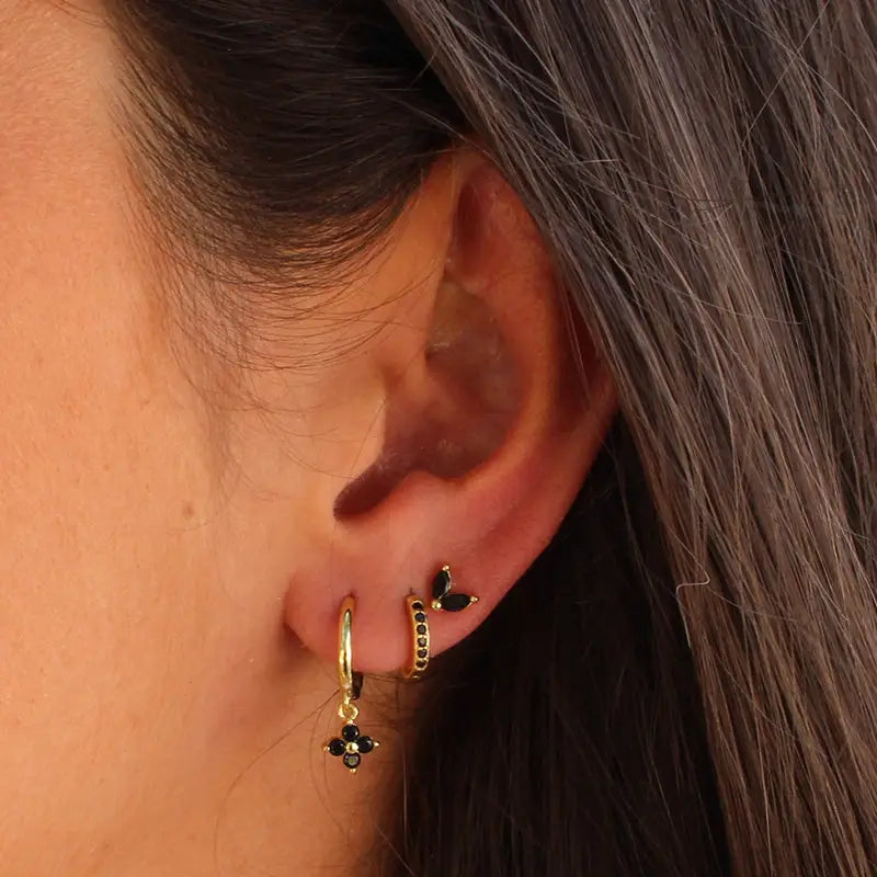floral and butterfly gold-toned hoop earrings adorned with black gemstones in a stylish set