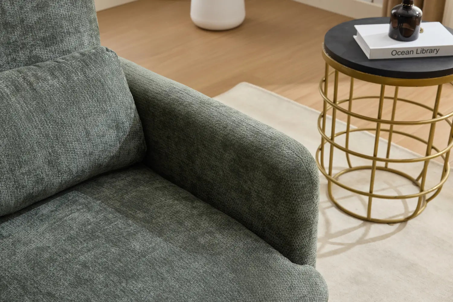 A plush dark green boucle fabric accent chair with a modern design and textured upholstery.