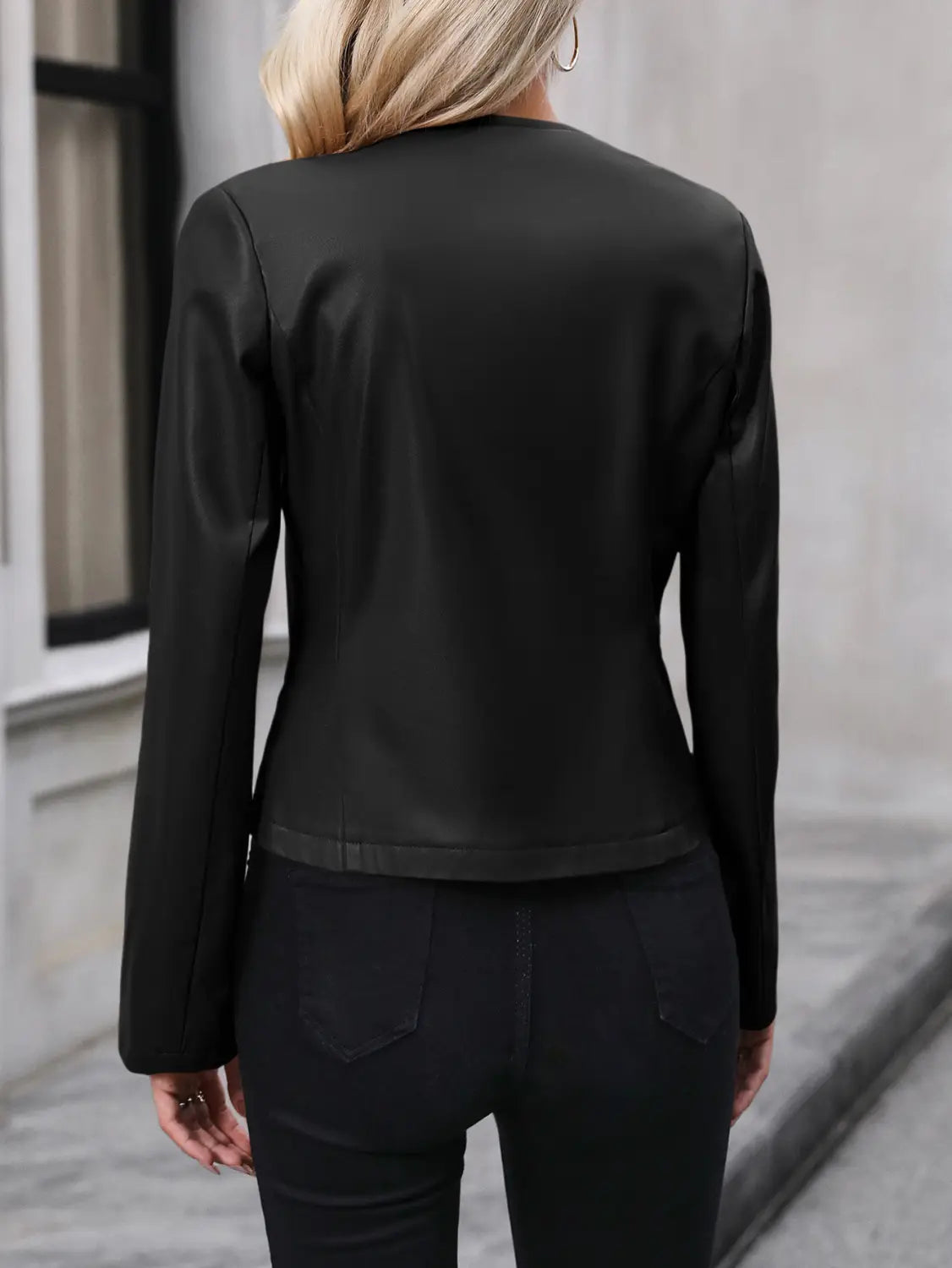 Women’s faux leather bomber jacket long sleeve outerwear in black satin-finish leather with a sleek fitted silhouette and subtle seam detailing.