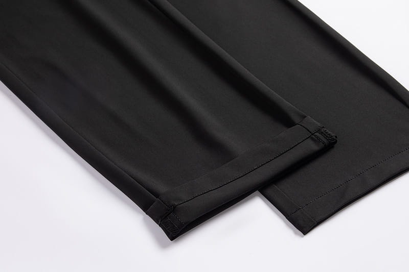 Men plus size black stretch casual trousers with smooth sleek fabric and neatly finished hems.