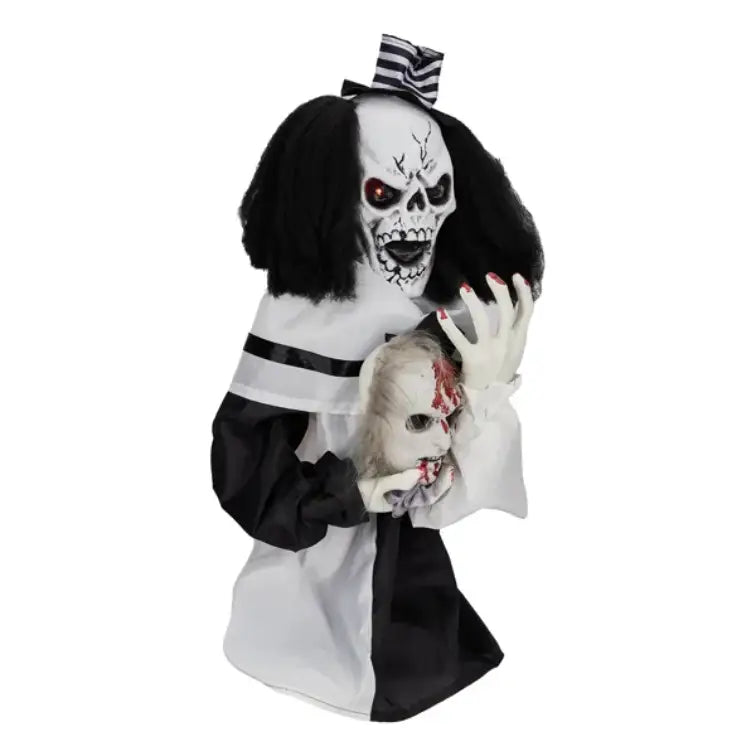 A black and white halloween animatronic figure dressed as a skeletal nurse with red glowing eyes holding a bloody doll head is a sound activated scary clown halloween decoration measuring 1.8 feet.