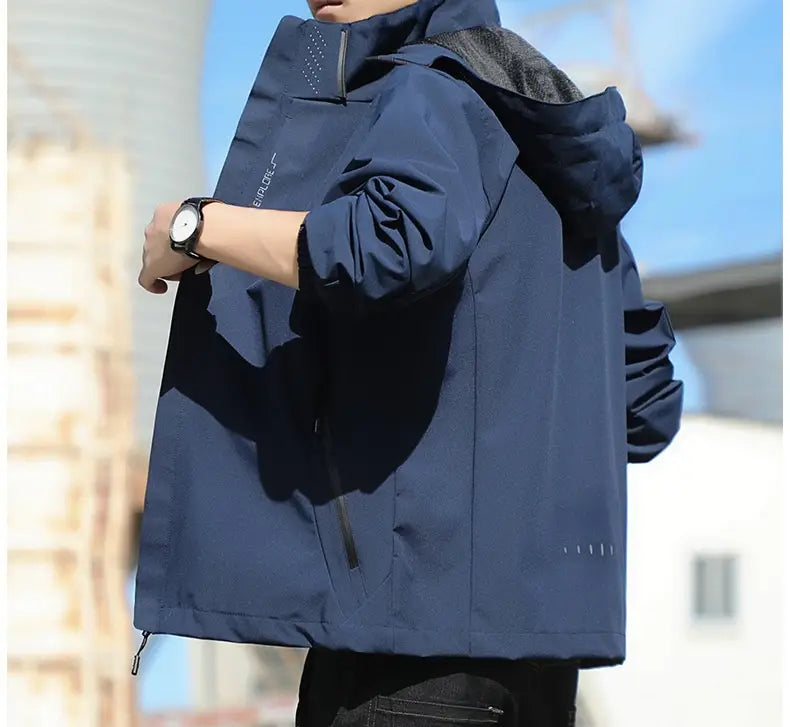 Men’s waterproof sports jacket in navy blue with a black mesh-lined hood and subtle white stitching details.