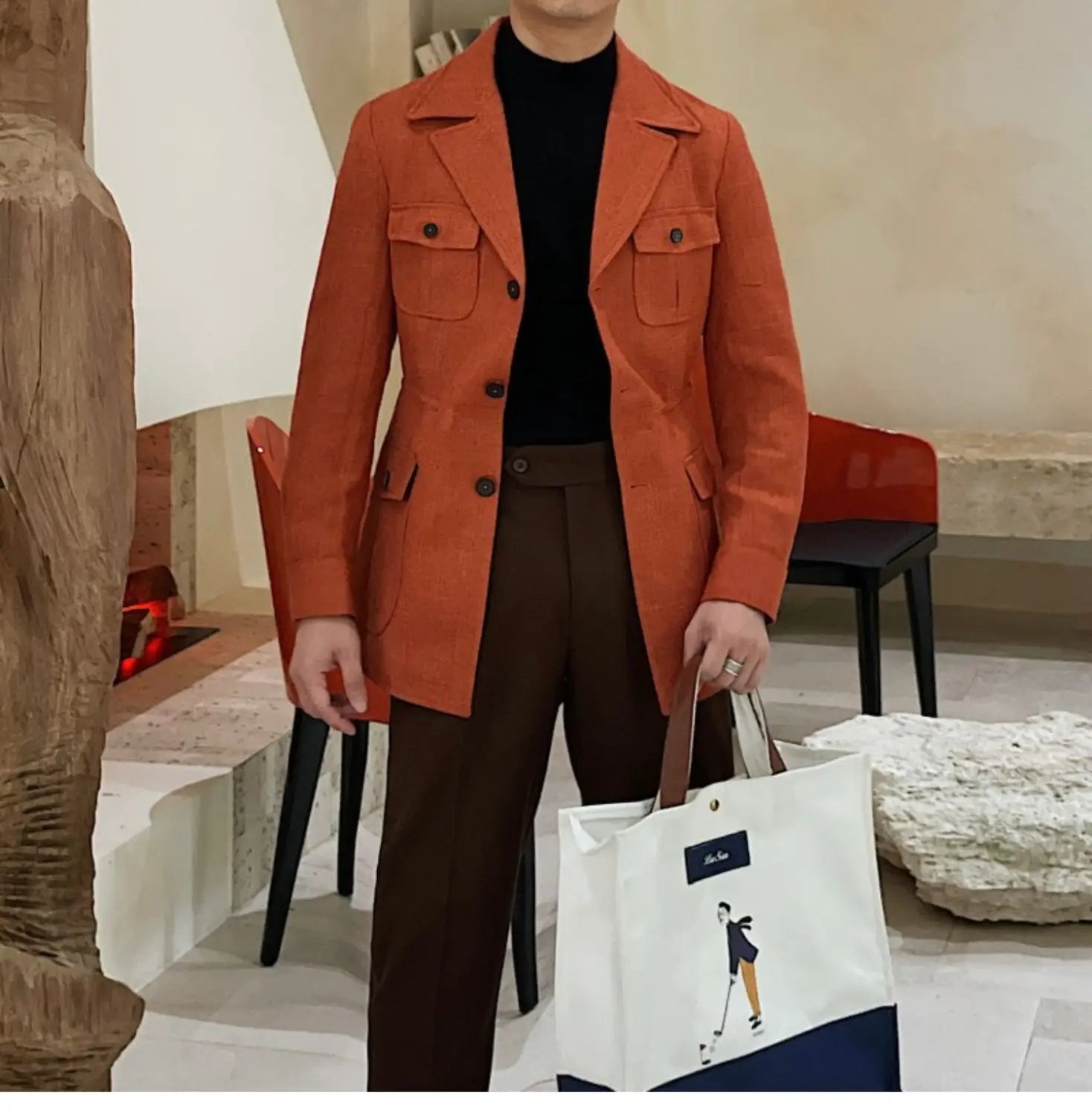 Veste de blazer ceinturée ajustée slim fit pour homme en suède orange, avec boutons noirs et deux poches poitrine.