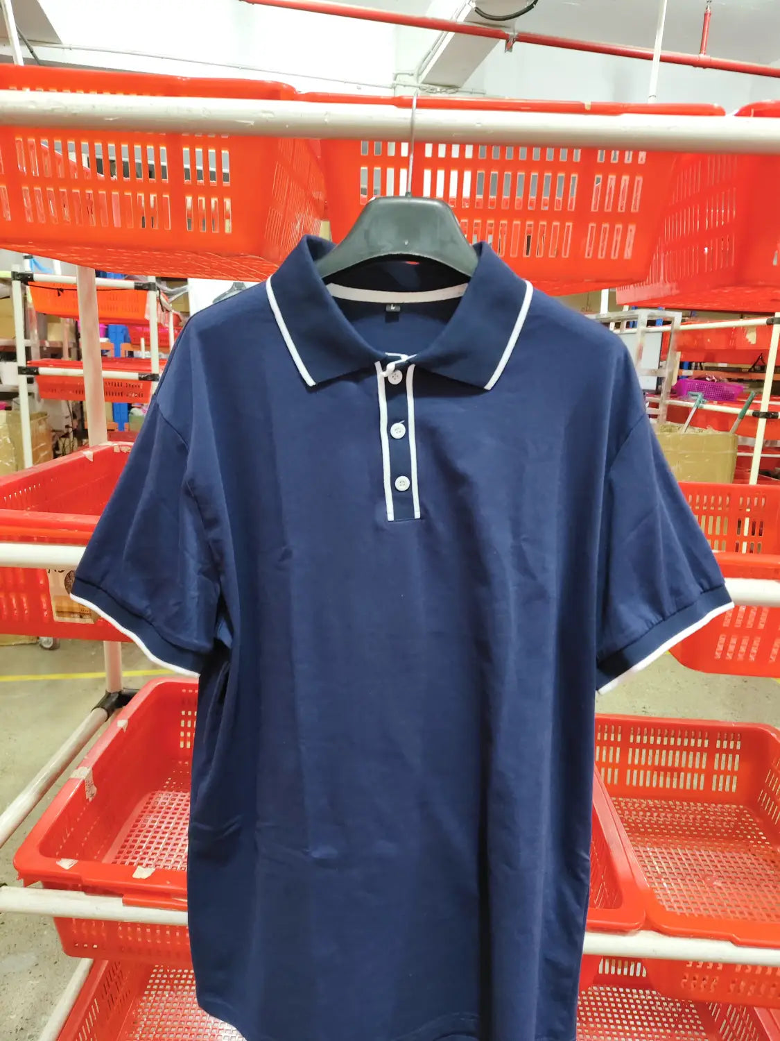Navy blue men jacquard short sleeve polo shirt with white trim on the collar and placket.