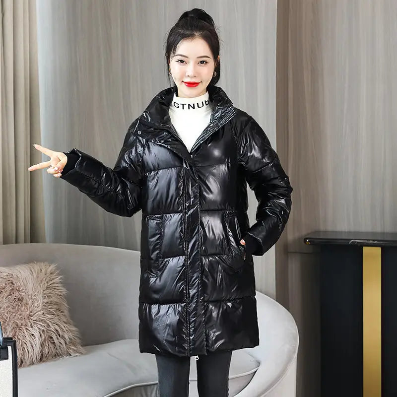 Glossy black plus size puffer jacket with a quilted design and high collar made of shiny material.