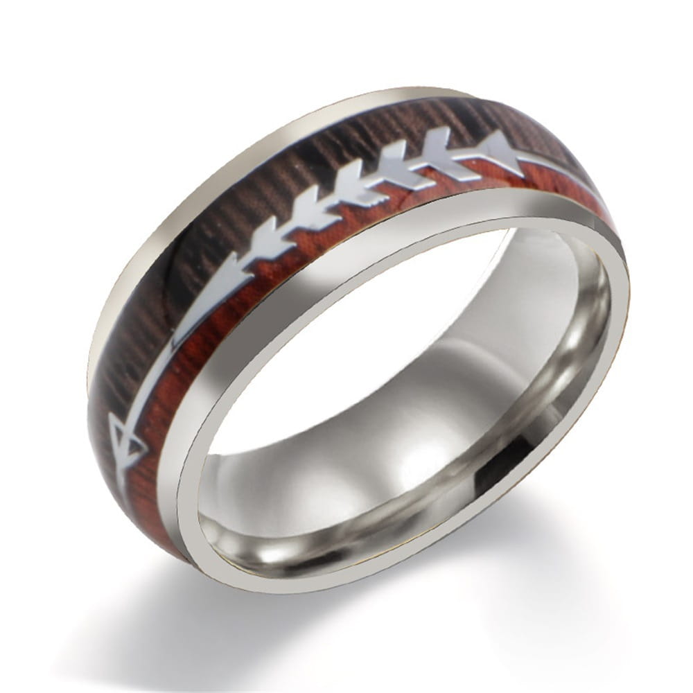 A sleek rose gold stainless steel ring featuring a dark wood grain inlay with silver arrowhead stitching details.