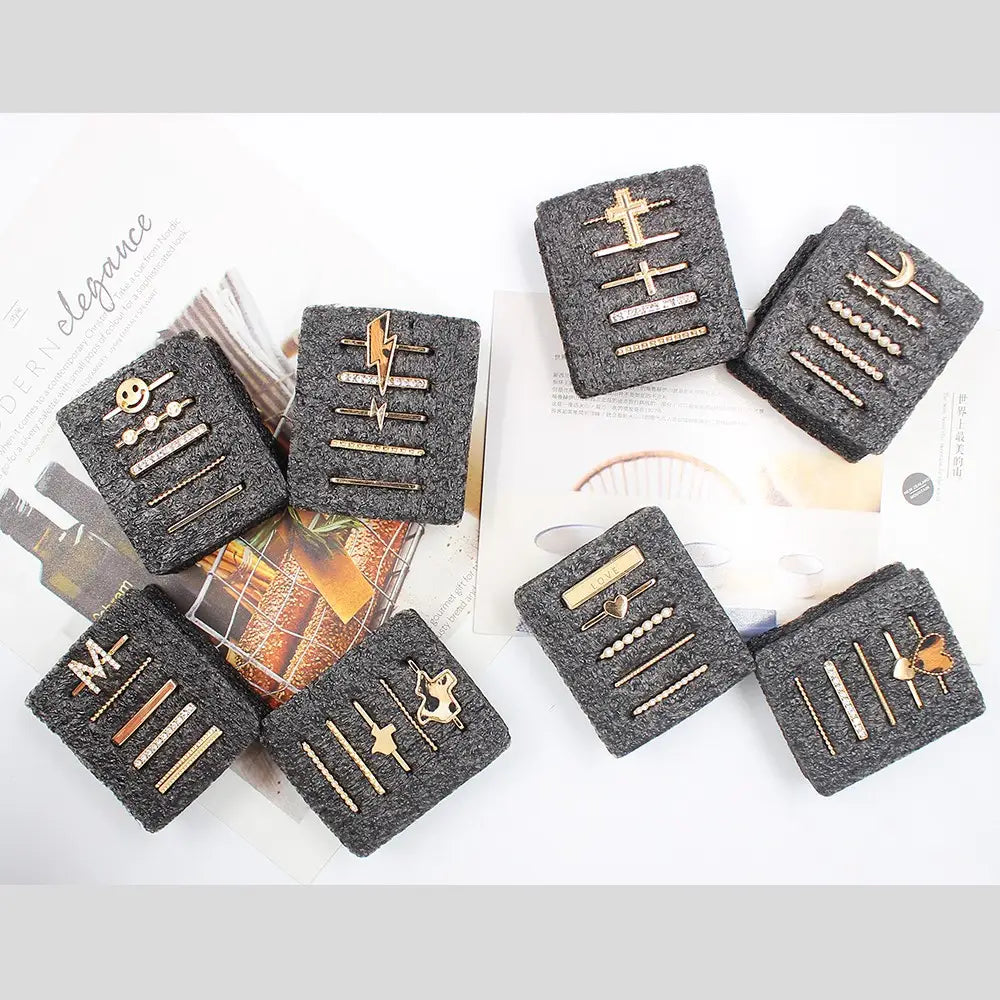 Set of six gold-toned and silver-tone stud earrings featuring lightning bolts, crosses, moons, hearts, and smiley faces from the gold embellished silicone strap decorative ring set.