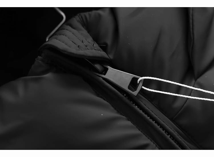 Black nylon zipper pull with white drawstring on hooded puffer cotton coat.