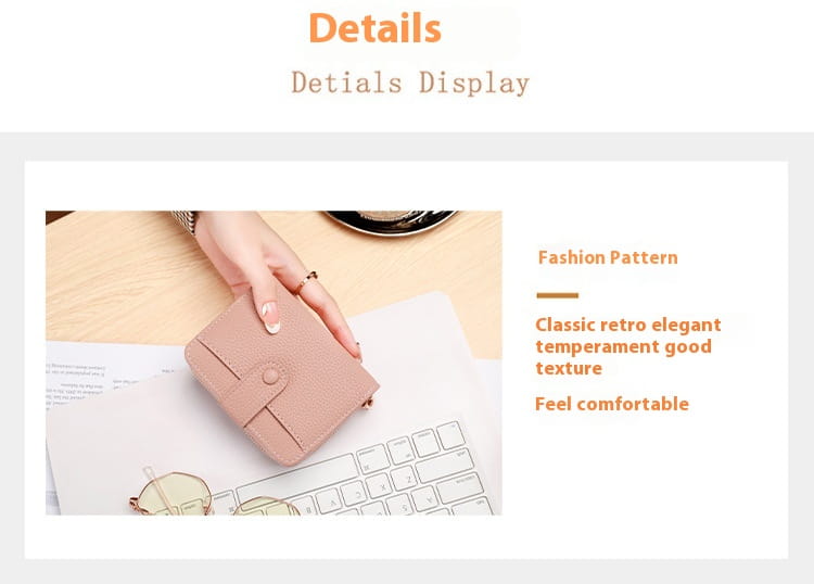A soft pink textured leather mini organ wallet with a classic retro design and single button closure.