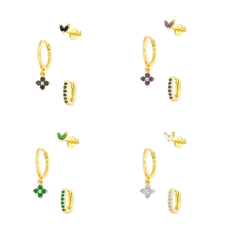 Floral and butterfly gold hoop earring set featuring dangling flower charms with pave-set black purple green and clear gemstones.