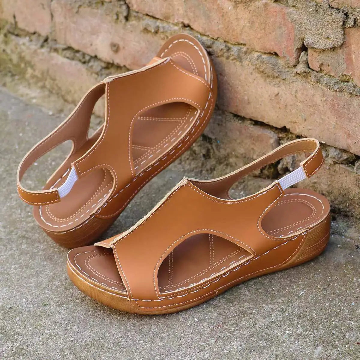 Tan recycled leather wedge sandals for women with elastic straps cutout details and white stitching for summer wear