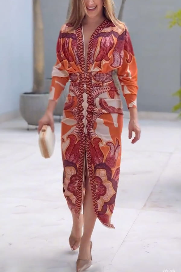 A vibrant orange and red printed v-neck geometric wrap midi dress with three-quarter sleeves and front zipper detail.