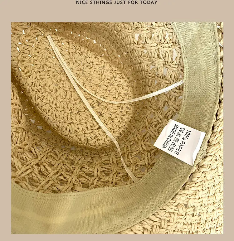 A light beige woven straw cowboy hat for men featuring a soft knitted fabric band and made of 100 percent paper.
