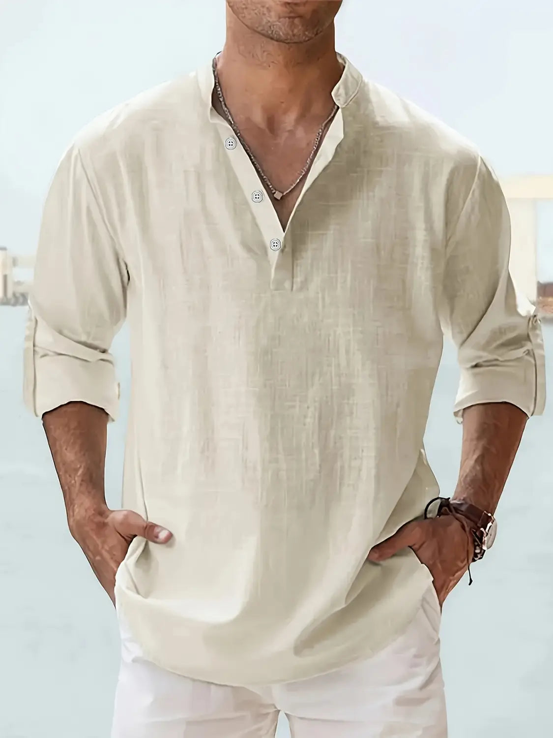 Beige linen button-down shirt with rolled sleeves and subtle texture from the men’s relaxed fit lightweight cotton and linen shirt collection.