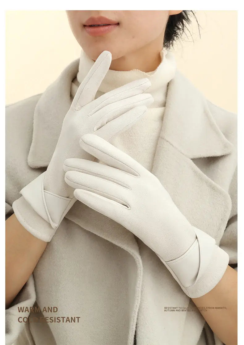 White leather touchscreen fleece lined bow gloves with a sleek elegant design and subtle stitching details shown from the back side.