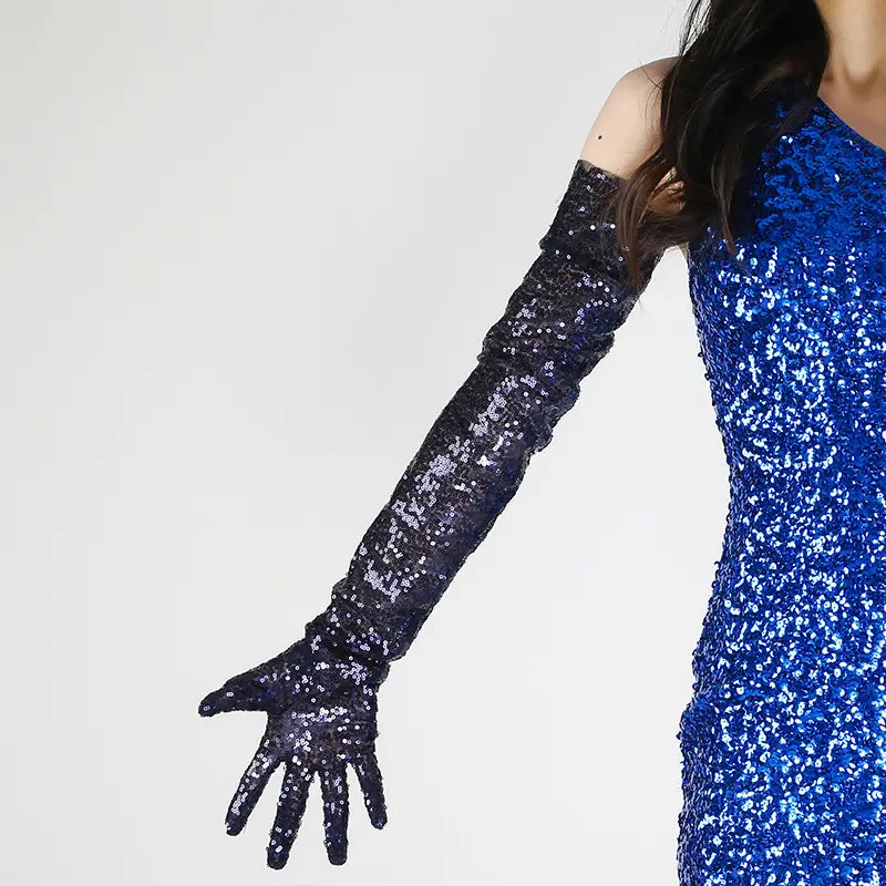 Long dark blue sequined opera gloves with a shimmering glittery texture from the sequined mesh finger gloves set.