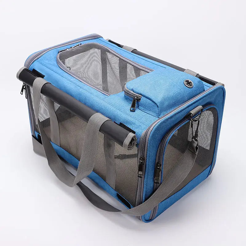 Breathable oxford pet carrier shoulder bag in blue and gray with mesh sides, retractable handle, and adjustable shoulder straps.