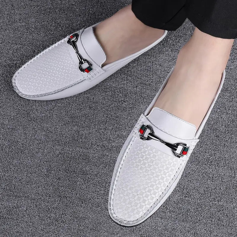 Men’s leather mule loafers in white woven leather with a black and red horsebit buckle accent.