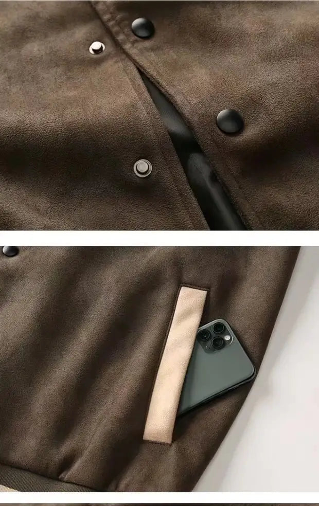 Brown suede varsity jacket in korean style with black snap buttons and a front pocket holding a smartphone suitable for casual wear.