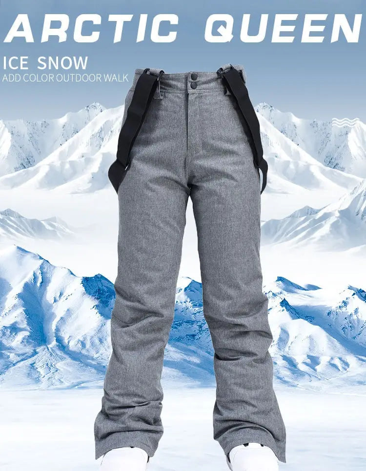 Men waterproof thermal snow pants in gray arctic queen with black adjustable suspenders designed for winter outdoor wear.